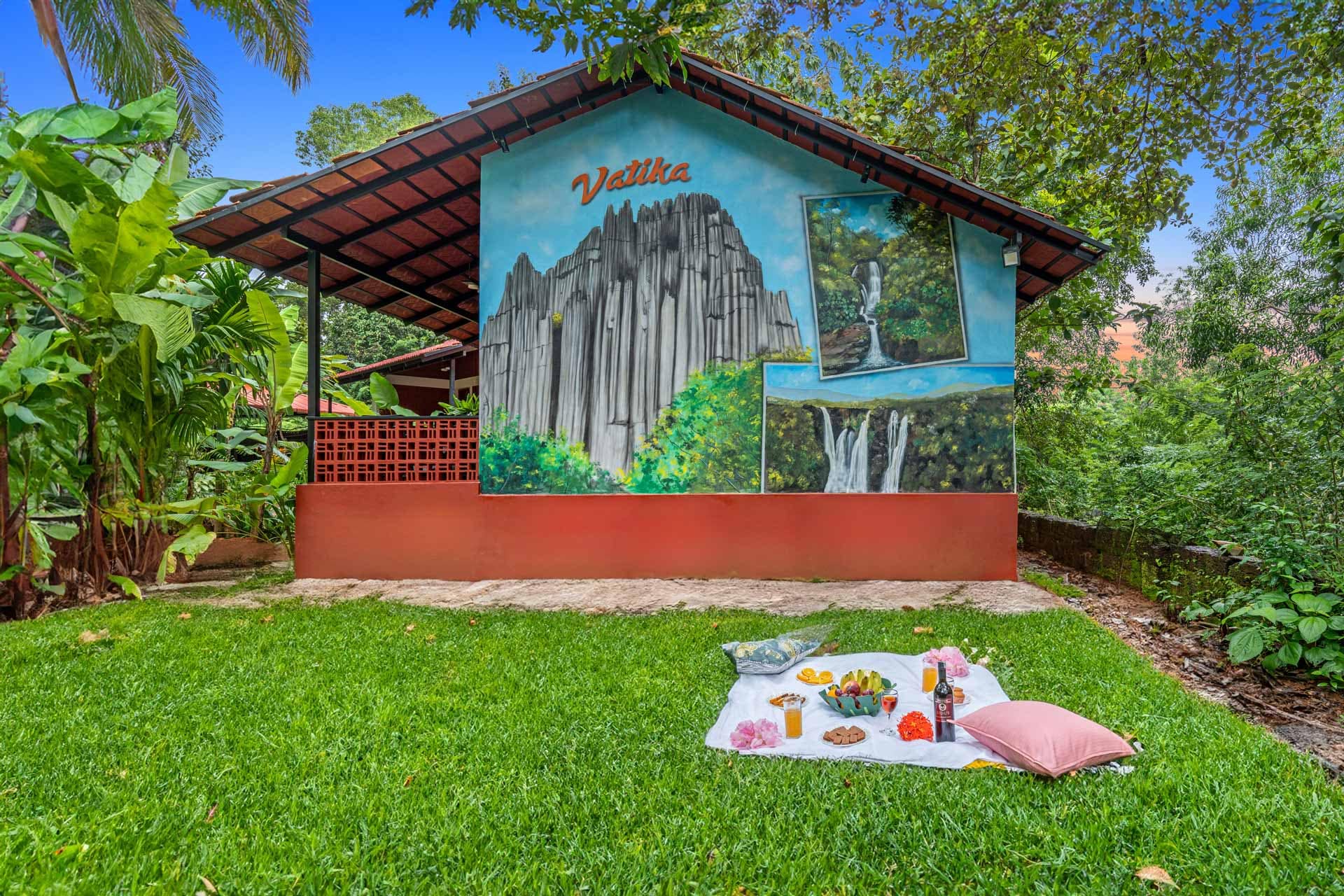 Vatika Nature Nest villa exterior with lawn